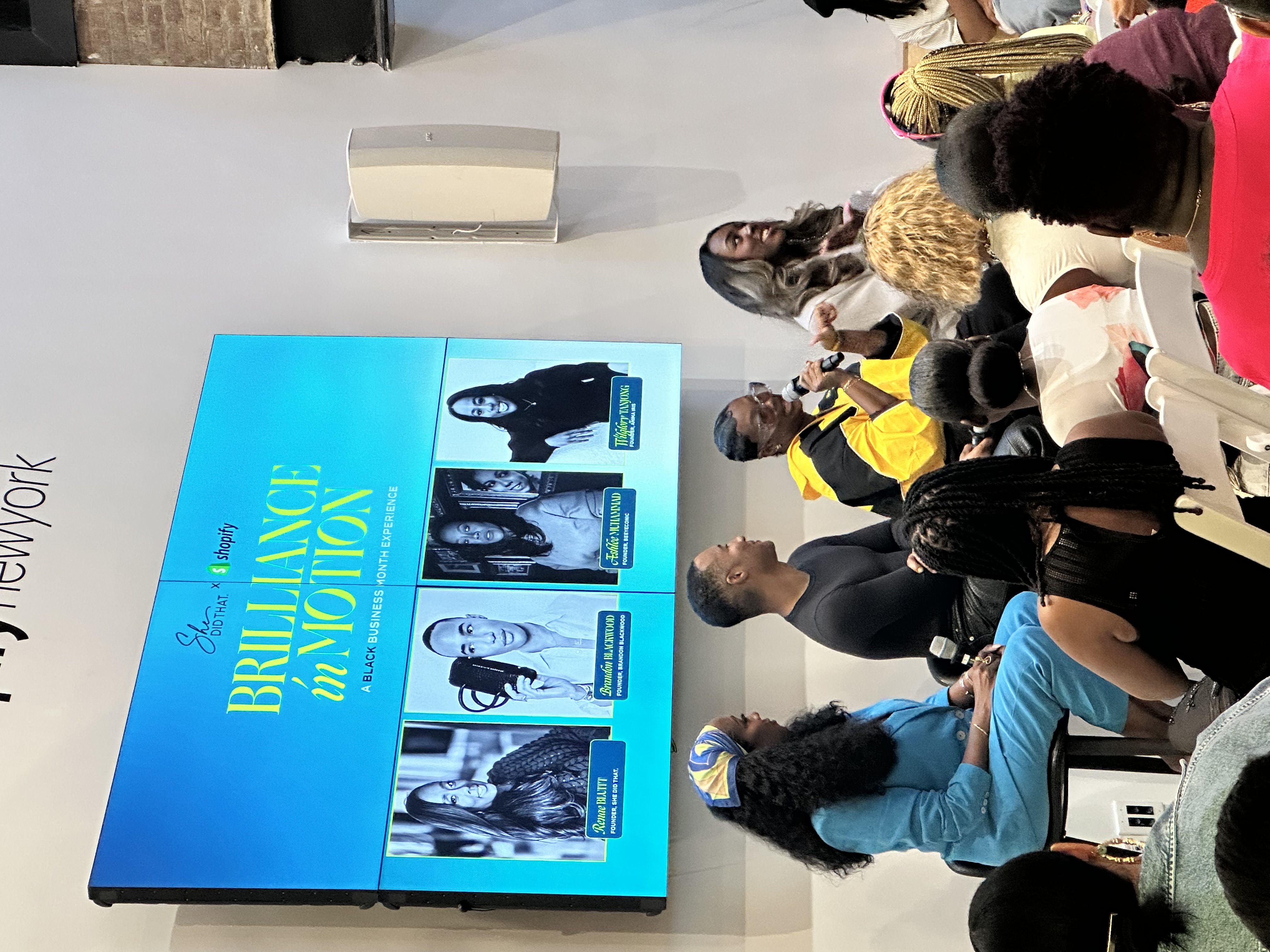Panel speakers in conversation onstage at Brilliance in Motion, a Black Business Month event hosted by She Did That. and Shopify.