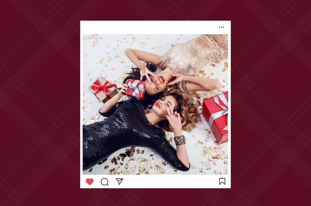 Two women laying in glitter and holding presents wrapped with bows.